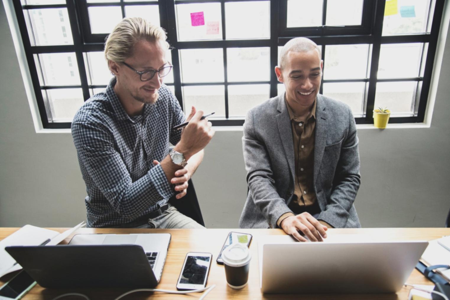 Financial professionals analyzing market data in modern office environment